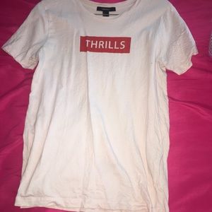 It is a light pink forever 21 shirt